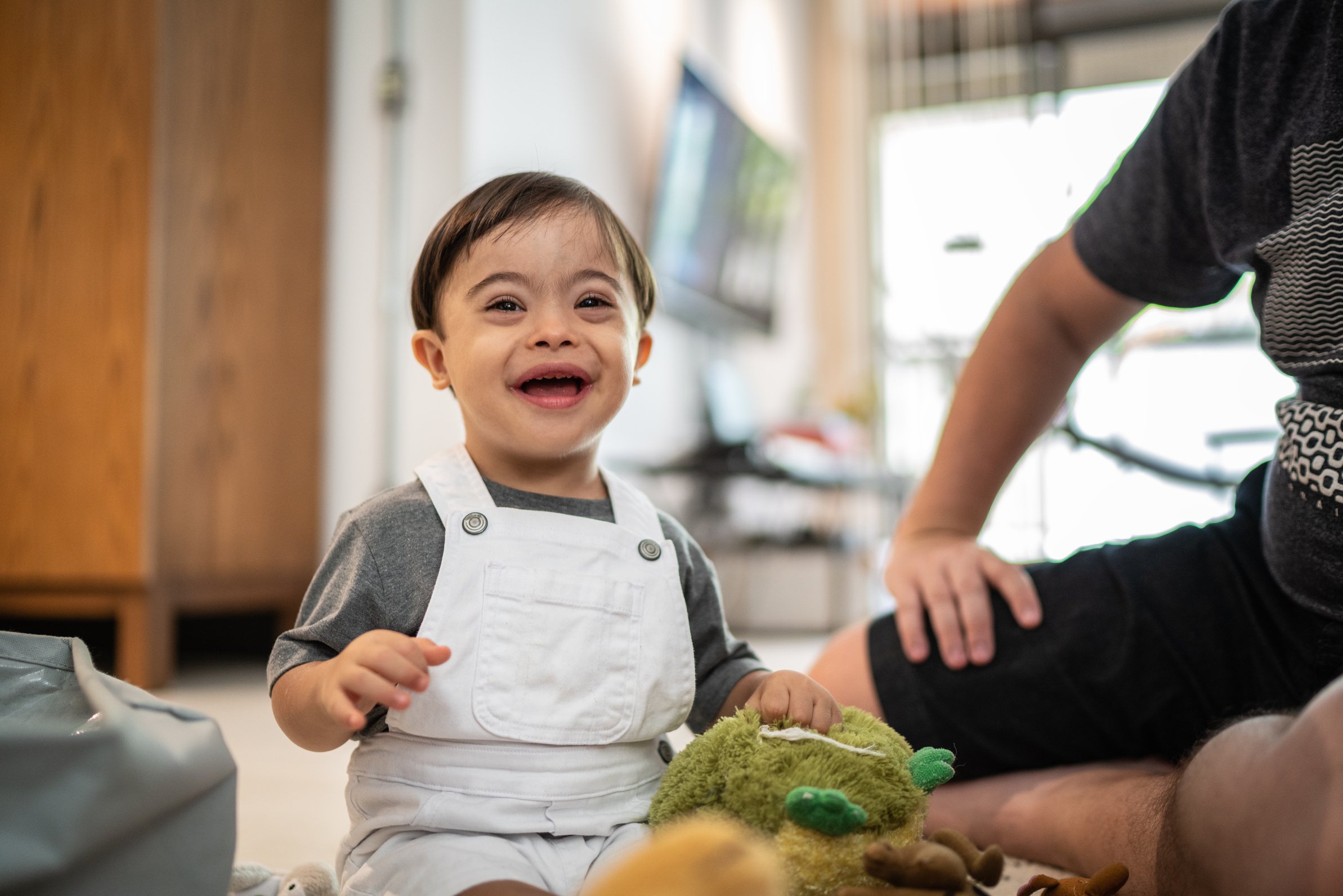 Down Syndrome Son Playing at Home